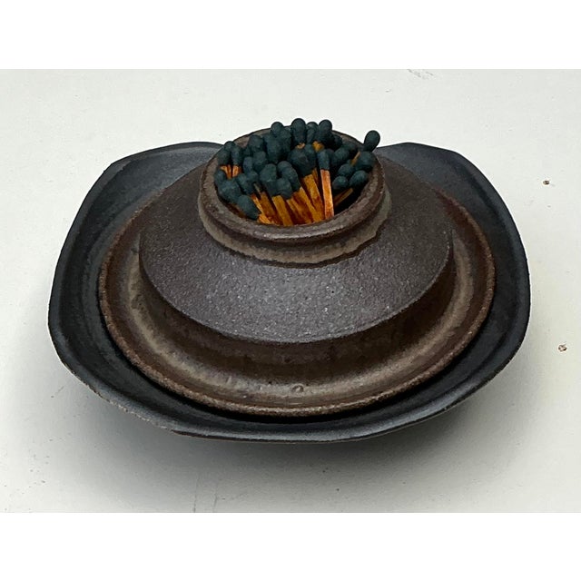 This exceptional two-piece studio pottery set is a masterclass in Brutalist texture and functional design, celebrating the...