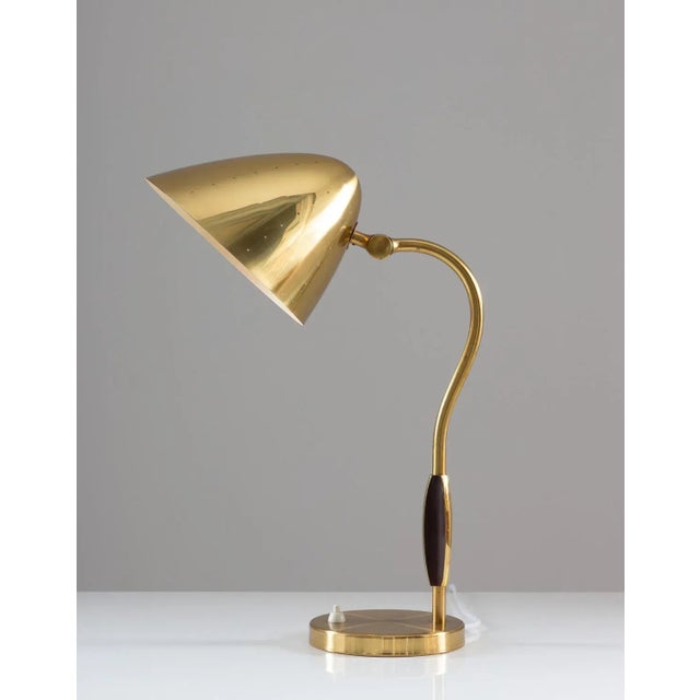 Swedish Mid-Century Modern table lamp in perforated brass by Swedish manufacturer Boréns, 1940s. This rare lamp is with...