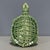 Add a touch of serene, organic charm to your space with this charming glazed ceramic turtle figurine. Featuring a rich...