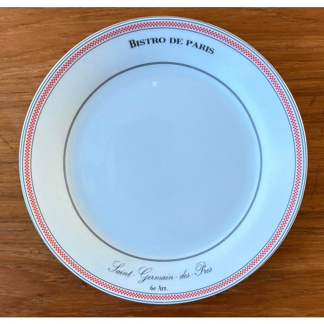 Set of 4 small appetizer or dessert plates in the "Bistro de Paris" pattern made by Kiss That Frog. Classic white...