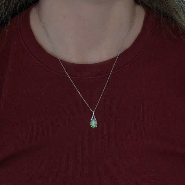 Elegant 2.3ct Ethiopian pendant necklace featuring a beautifully cut 10x8mm natural Ethiopian gemstone, showcasing vibrant...