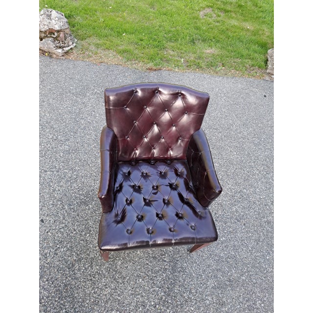 Antique soft studded leather armchair reddish brown with label and front wheels. Ask about shipping and delivery from...