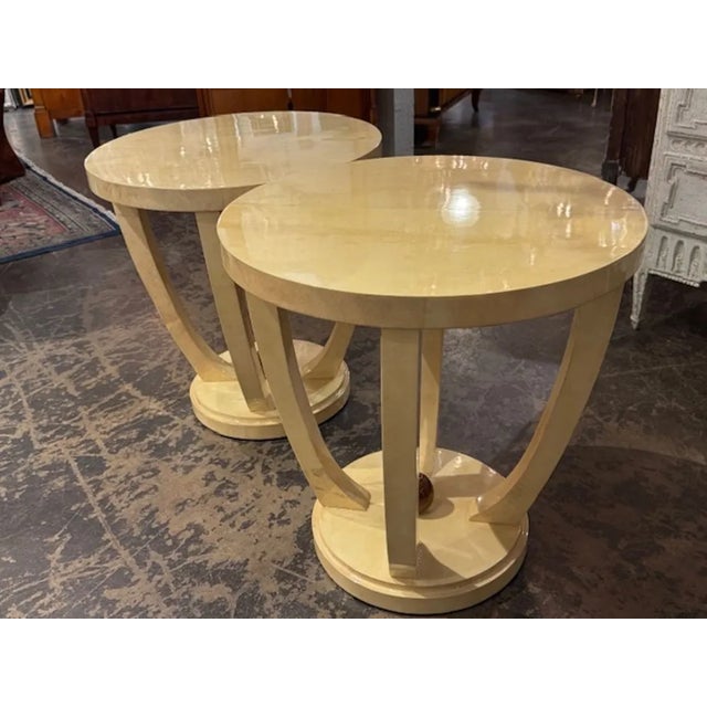 This product is a pair of Italian Art Deco style creme colored lacquered parchment tables. The tables are very unique ,...