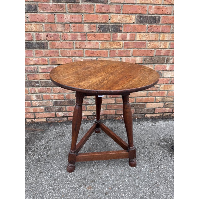 This is a 19th century English pine cricket table commonly used in pubs. These tables are highly desirable and sought...