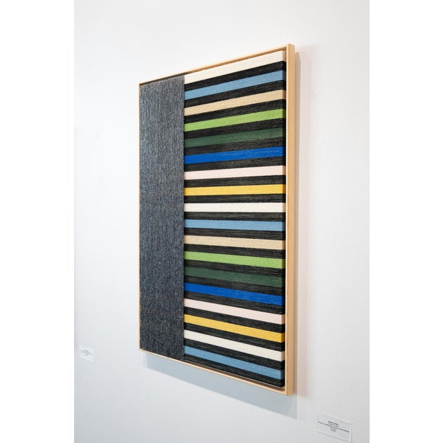 Color blocked wrapped wooden work featuring Anna Beurskens classic use of yarn and linear elements.