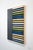 Color blocked wrapped wooden work featuring Anna Beurskens classic use of yarn and linear elements.
