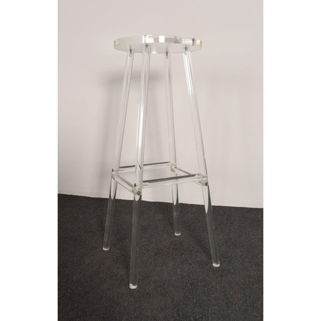 Lucite bar stool with fixed seat in the style of Charles Hollis Jones (ca. 1970s, USA). Elegant, minimal form whose...
