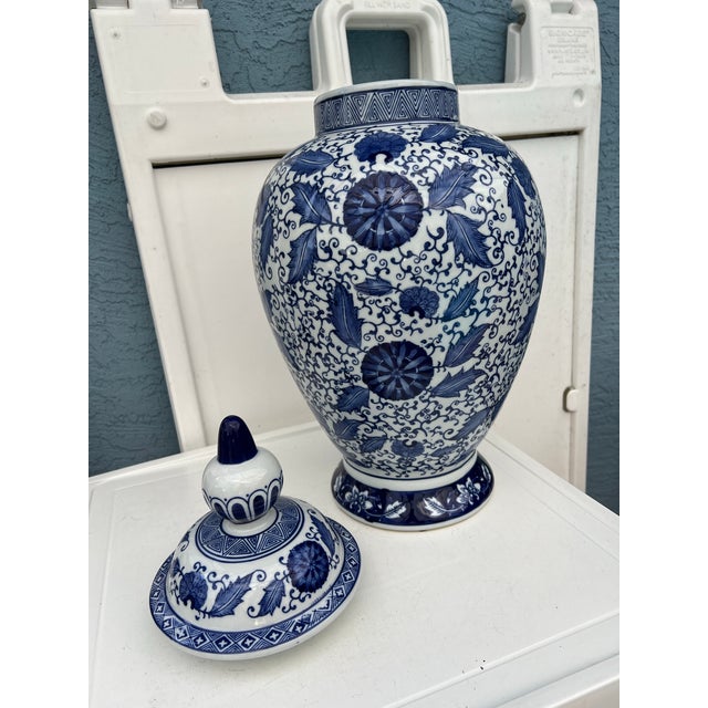 Vintage decorative blue and white porcelain ginger jar featuring intricate floral and foliate patterns. From Pier One...