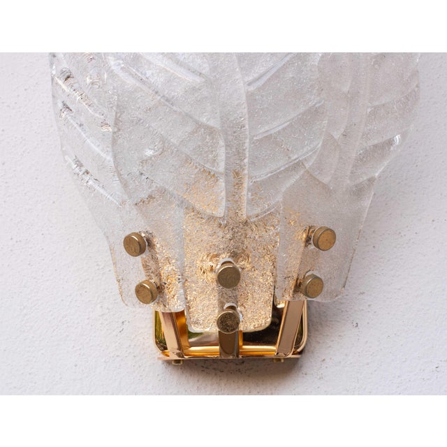 Stunning set of 4 of Murano Glass wall lamps. Each lamp is composed of 3 leaves in transparent glass. One light socket,...