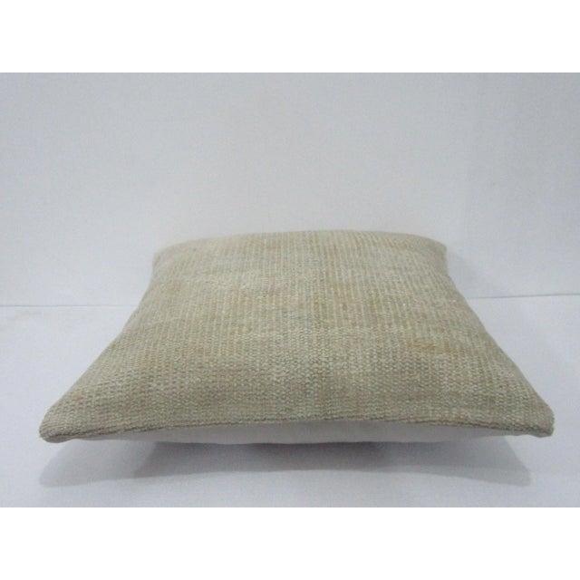 Decorative pillow cover made from a vintage Turkish handknotted rug. Backed with good quality cotton fabric. Pillow...