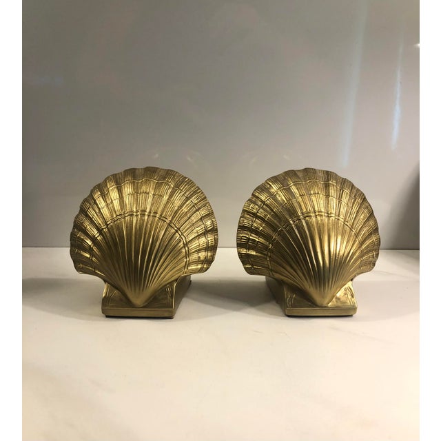 This fabulous Pair of 1950s Heavy Brass Clam Sea Shell Bookends will be a sophisticated option for any traditional decor...