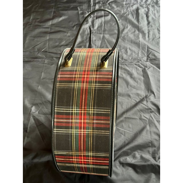 This vintage tartan plaid hat box would make a very cool as well decorative place to store a retro chapeau or anything...