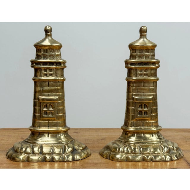Charming vintage pair of heavy brass bookends in shape of lighthouses. Nice detail with great presence. Lovely patina.