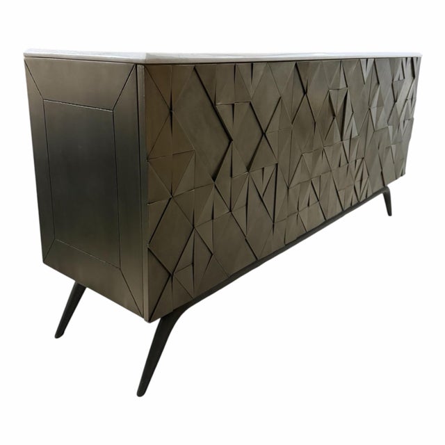 A striking statement cabinet by Global Views featuring the Triangle design with individually hand-applied antique silver-...