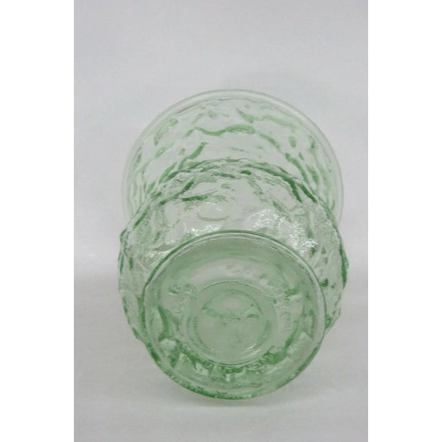 This classic depression glass vase has a lovely green color and a brilliant rippled / pebble texture to the glass. The...