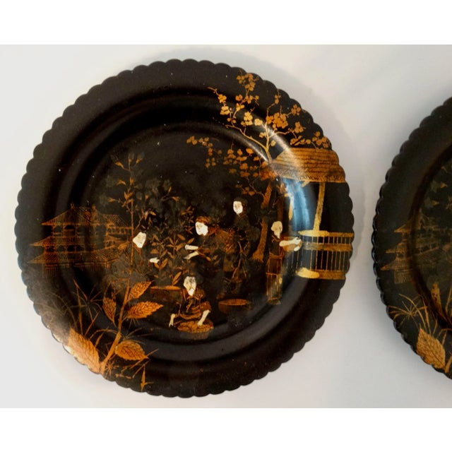 A pair of lovely 19th-Century Chinese export lacquer chinoiserie gaming plates or trays. They are handcrafted of papier...
