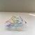 Classic Zanfirico Murano hand blown dish with twisting ribbon swirls in multiple colors upon a white net background....