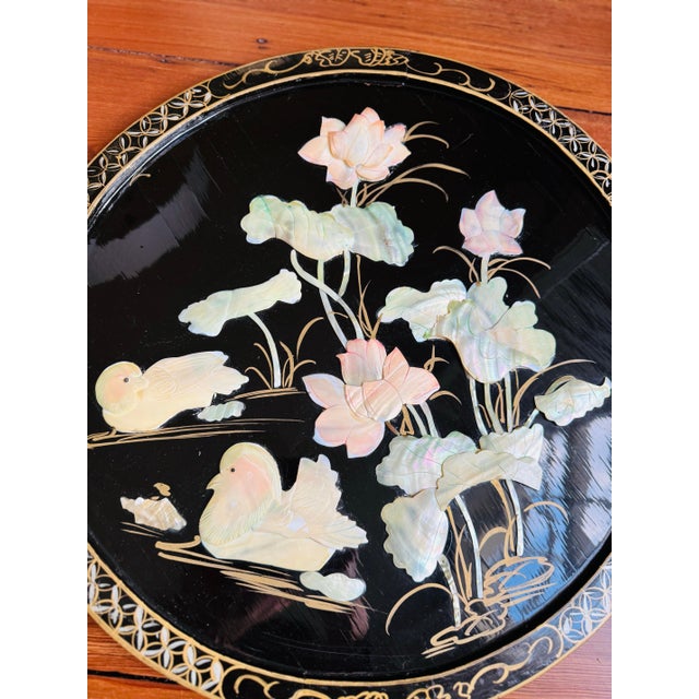 Vintage pair! Beautiful pearl inlay. Black chinoiserie round wall art/plaques. One has minor damage to the pearl inlay....