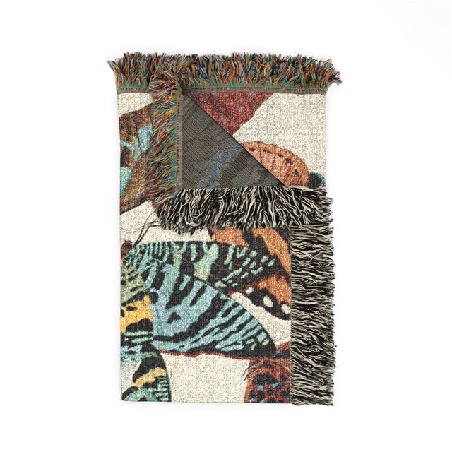 This butterfly woven throw blanket features oversized, colorful butterflies adapted from an illustration by Émile-Allain...