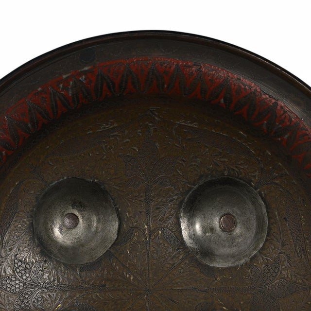 Intriguing historical 19th Century Indo Persian shield, handcrafted in bronze with four protuberances and engraved floral...