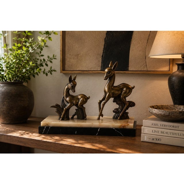 A striking pair of Art Deco deer, beautifully cast in Zamac and mounted on a solid marble base. This elegant figurine...