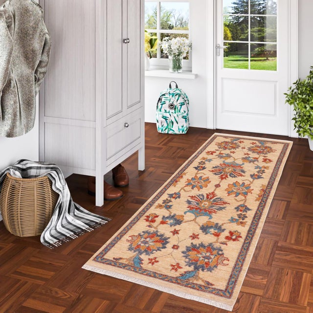 Enhance the ambiance of your home with this magnificent Persian-influenced Turkish hand-knotted rug made by skilled...