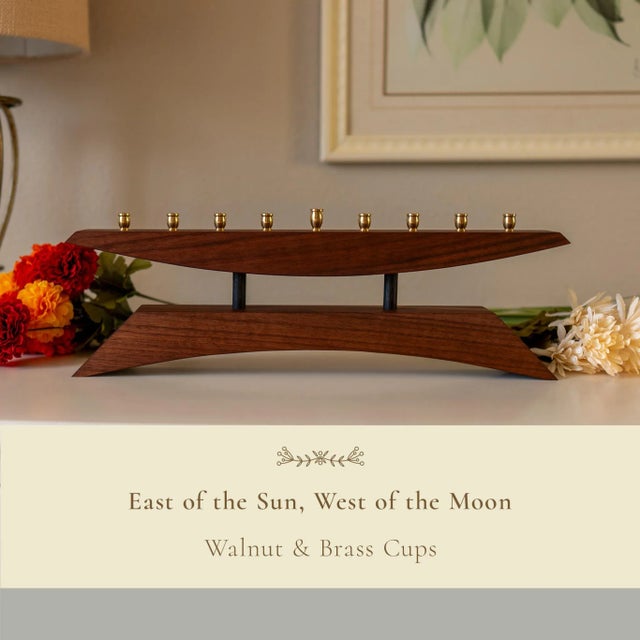 East of the Sun – Mid-Century Modern Walnut & Brass Menorah Let the Festival of Lights shine a little brighter with “East...