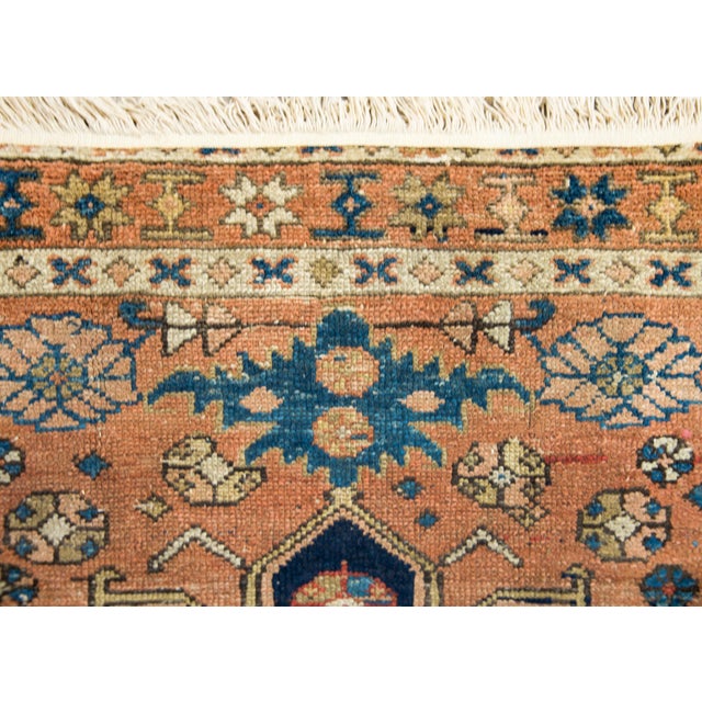 A beautiful early 20th century Persian Karadja rug with a stylized floral medallion living amidst a field of more stylized...