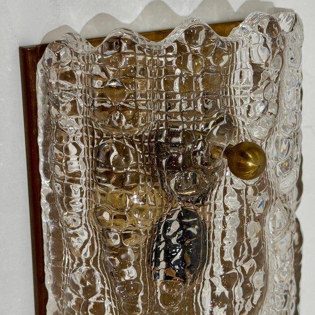 Pair of Carl Fagerlund art glass sconces for Orrefors. Sweden, c1960's. Heavily textured domed glass half shades, fitted...