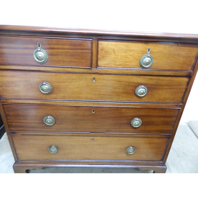 This Edwardian mahogany chest of drawers is a stunning antique piece with a solid brass handle finish. Handcrafted in the...