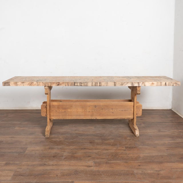 19th-century Swedish work table or console with an original pine base and a reclaimed wood top. The base retains early...