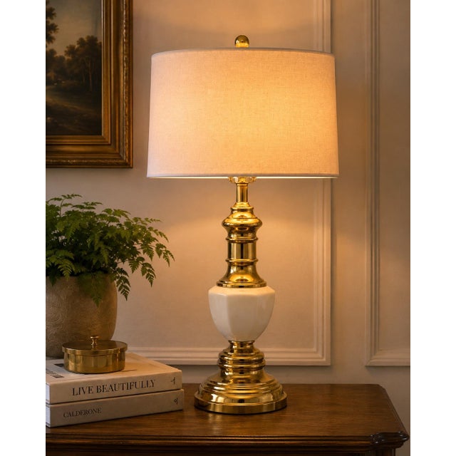 Bring timeless elegance into your home with this beautifully restored vintage brass and milk glass table lamp. Combining...