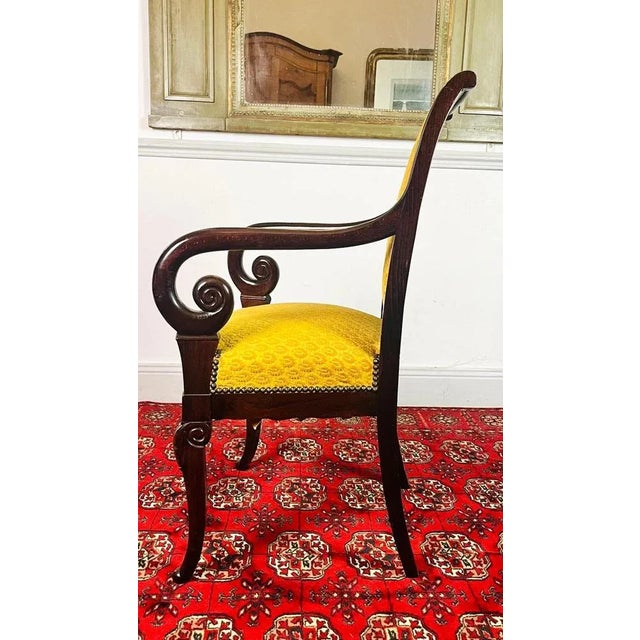 Very pretty carved mahogany armchair from the Restoration period - 19th century. The backrest is slightly reversed for...