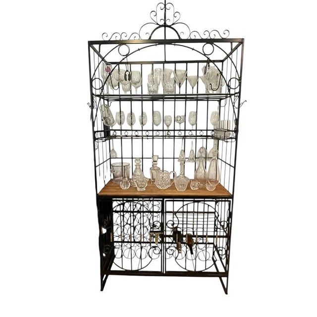LARGE WROUGHT IRON WINE STORAGE RACK WITH WOOD SHELF AND GLASS HOLDER -Tall wrought iron wine storage rack with ornate...