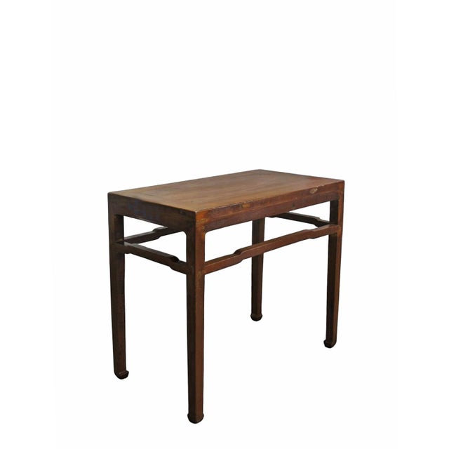 This solid wood side table features a classic square-corner construction with a flush-sided rectangular top. The frame is...