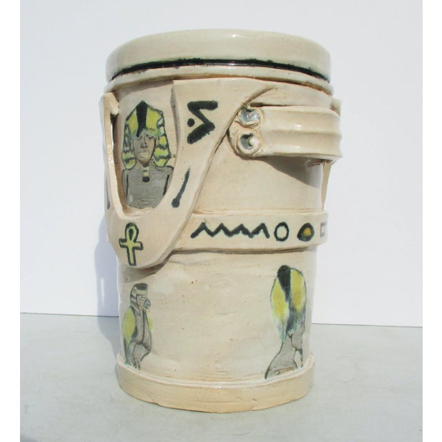 Handmade and coil built body in very thick coils of clay. Handmade central cylinder with enriched details of old-fashioned...