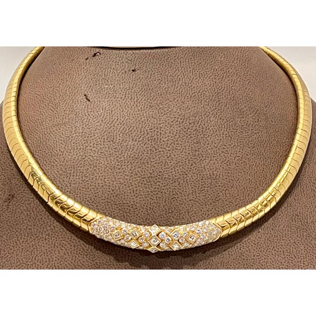 A prestigious piece by Van Cleef & Arpels, this flexible collar necklace is pavé set with an opulence of white diamonds,...