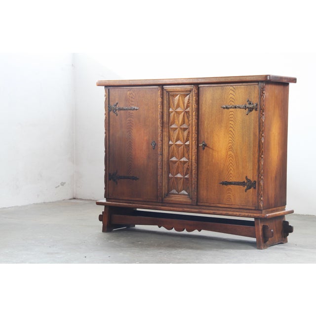 This mid-century cabinet reflects the Baroque Brutalist style that emerged in Denmark in the 1960s. Often attributed to...