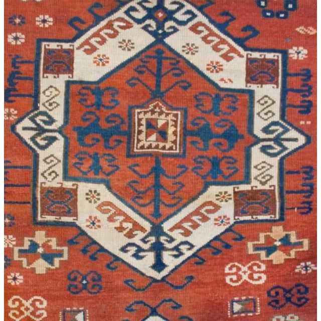 A fascinating late 19th century Persian Fachralo Kazak rug with an incredible pattern consisting of two large medallions...