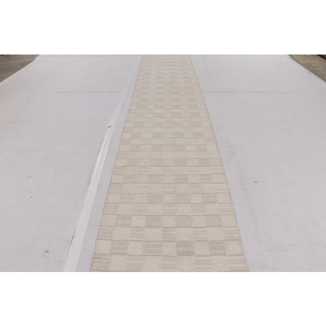 Handwoven in wool, this 3x27 Scandinavian runner flatweave from Rug & Kilim features geometric patterns and high-low pile...