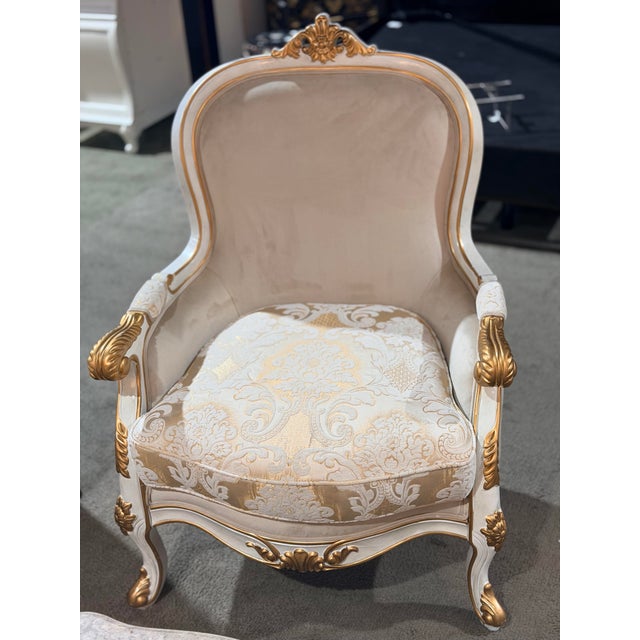 Elevate your space with this exquisite Homey Design “Mazie” Chair, a statement piece that embodies classic European...