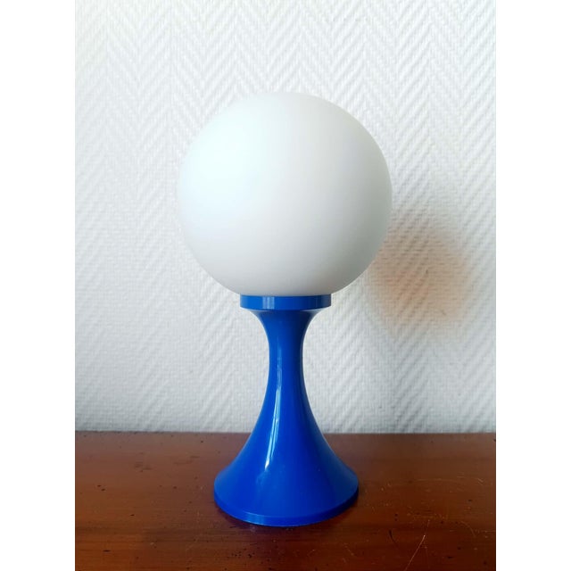Tulip lamp, space age style, 1970s work. White plastic tulip base with flared stem. Round white opaline glass shade....