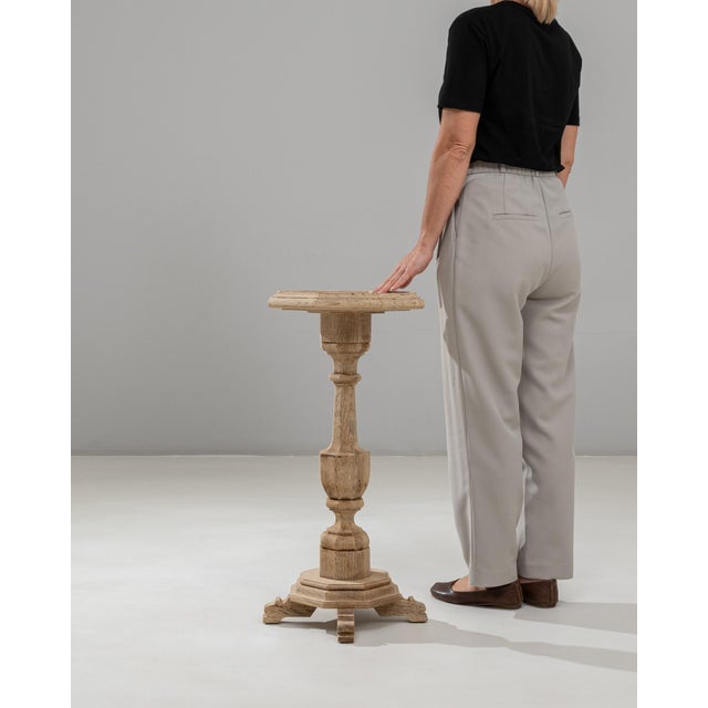 This 1890s French Baroque Revival oak pedestal table showcases the bold sculptural presence and ornate craftsmanship...