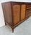 This listing is for a Mid-Century Modern Lane Rhythm Walnut Sideboard. Featuring a straight line design, two cane doors...