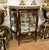 Elegant and richly detailed, this French Louis XV-style display cabinet is crafted from solid wood and designed to...