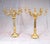 You are viewing an exquisite pair of English gilt candelabras in the manner of Paul Storr. The pair stand in each at an...