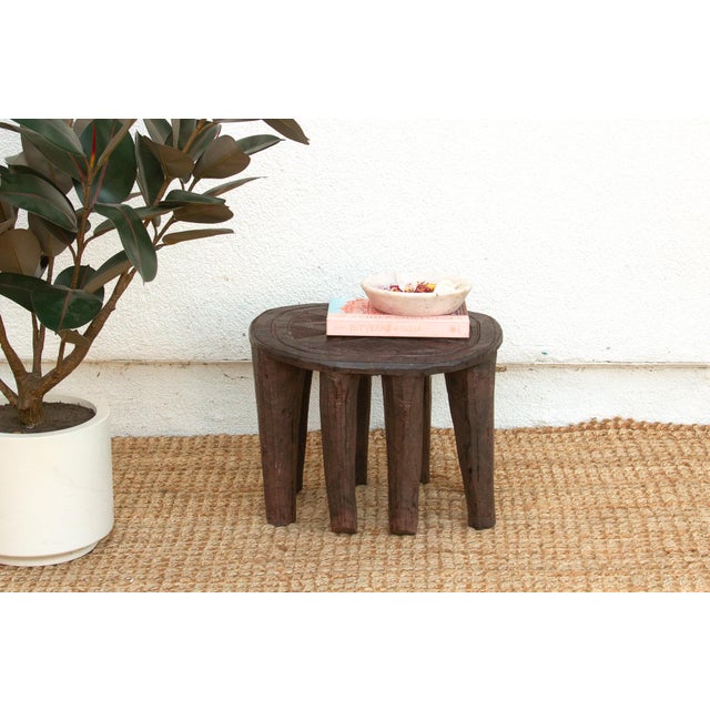 A unique piece of African art, this vintage Nupe table from Nigeria is a must-have for collectors and enthusiasts of Nupe...