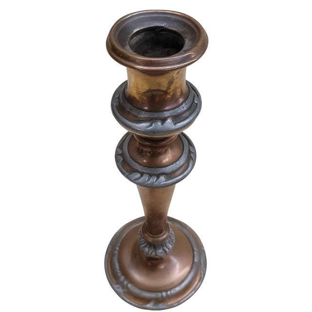Handsome Craftsman-era candlestick in warm copper with pewter overlay bands (leaf/scroll motif). Hollow form with cast-...