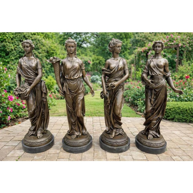 An extraordinary and complete set of four large vintage cast bronze allegorical statues depicting "The Four Seasons" (Les...