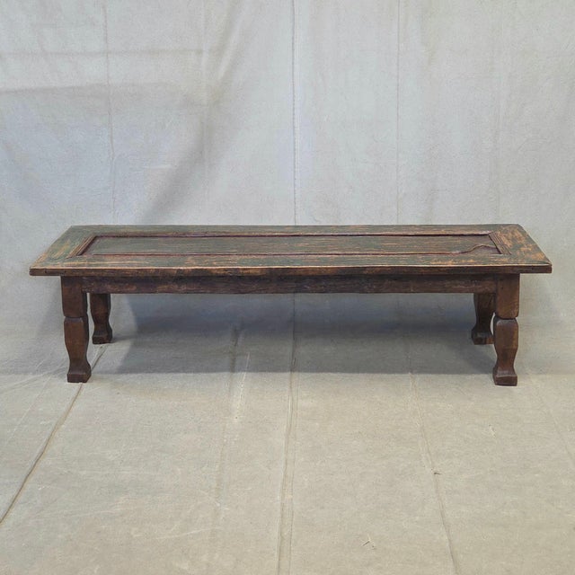 A charming old rustic door with original green paint from India was salvaged and refashioned into a coffee table at some...